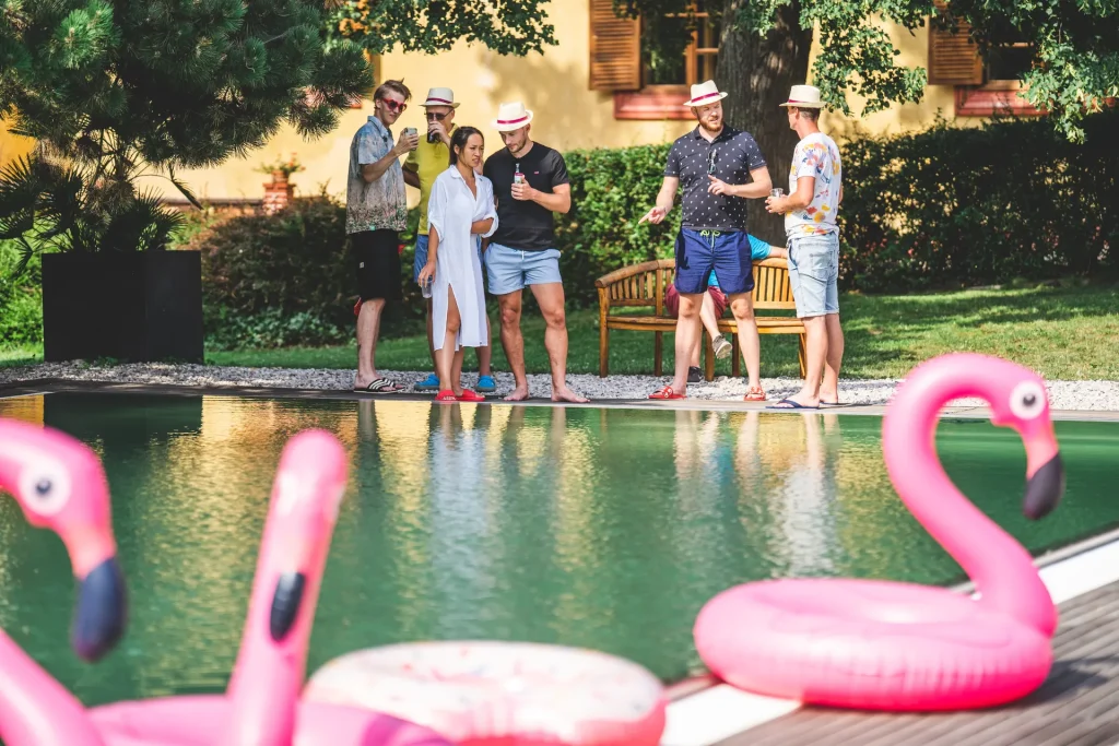 Dvůr Pecínov – Guests by the pool at a summer event